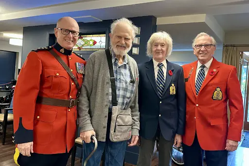Victoria Division Vets visiting with a fellow Veteran at a Victoria seniors' residence on Remembrance Day 2024<br />
